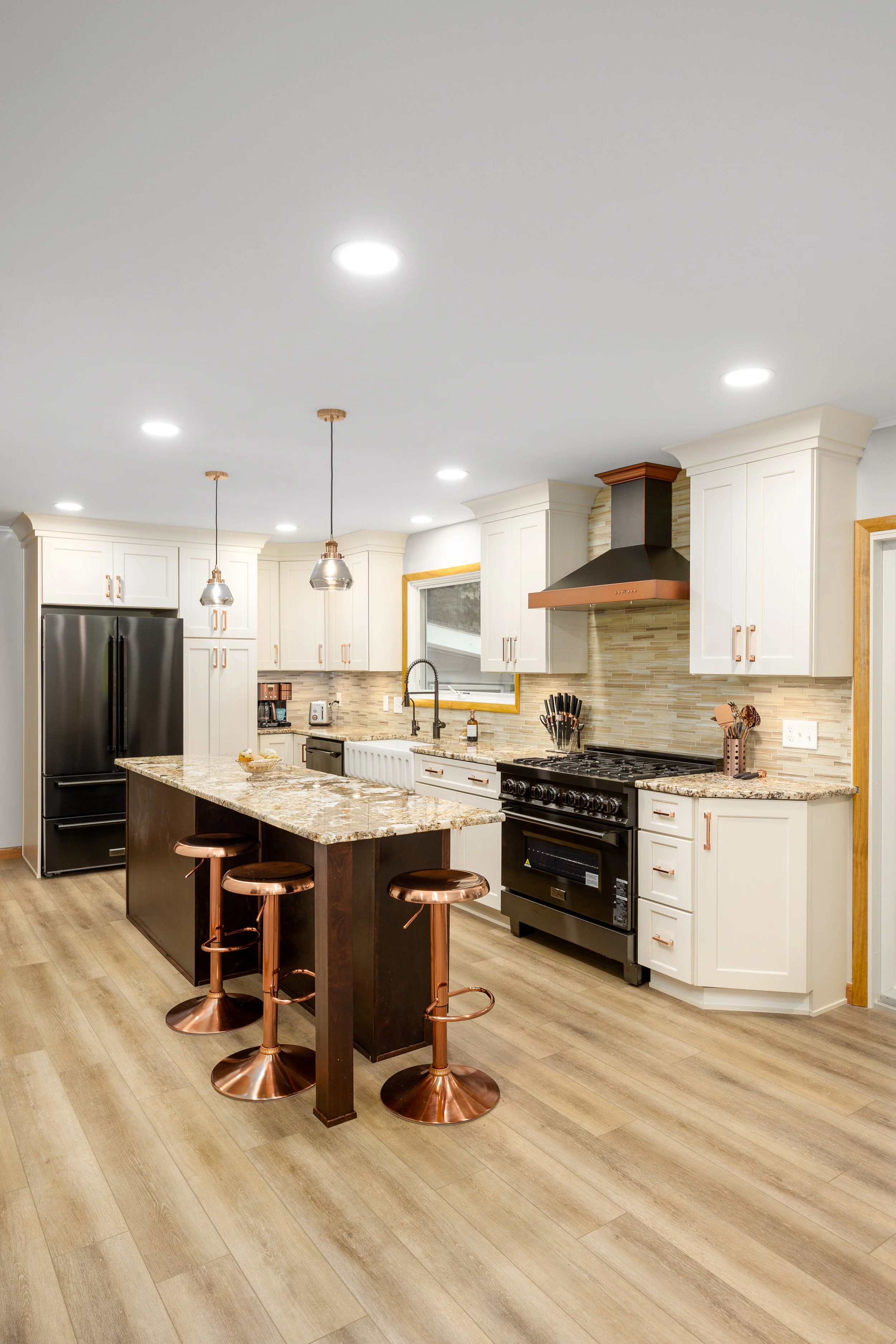 Remodeled Mik Homes kitchen with custom cabinetry and a large island