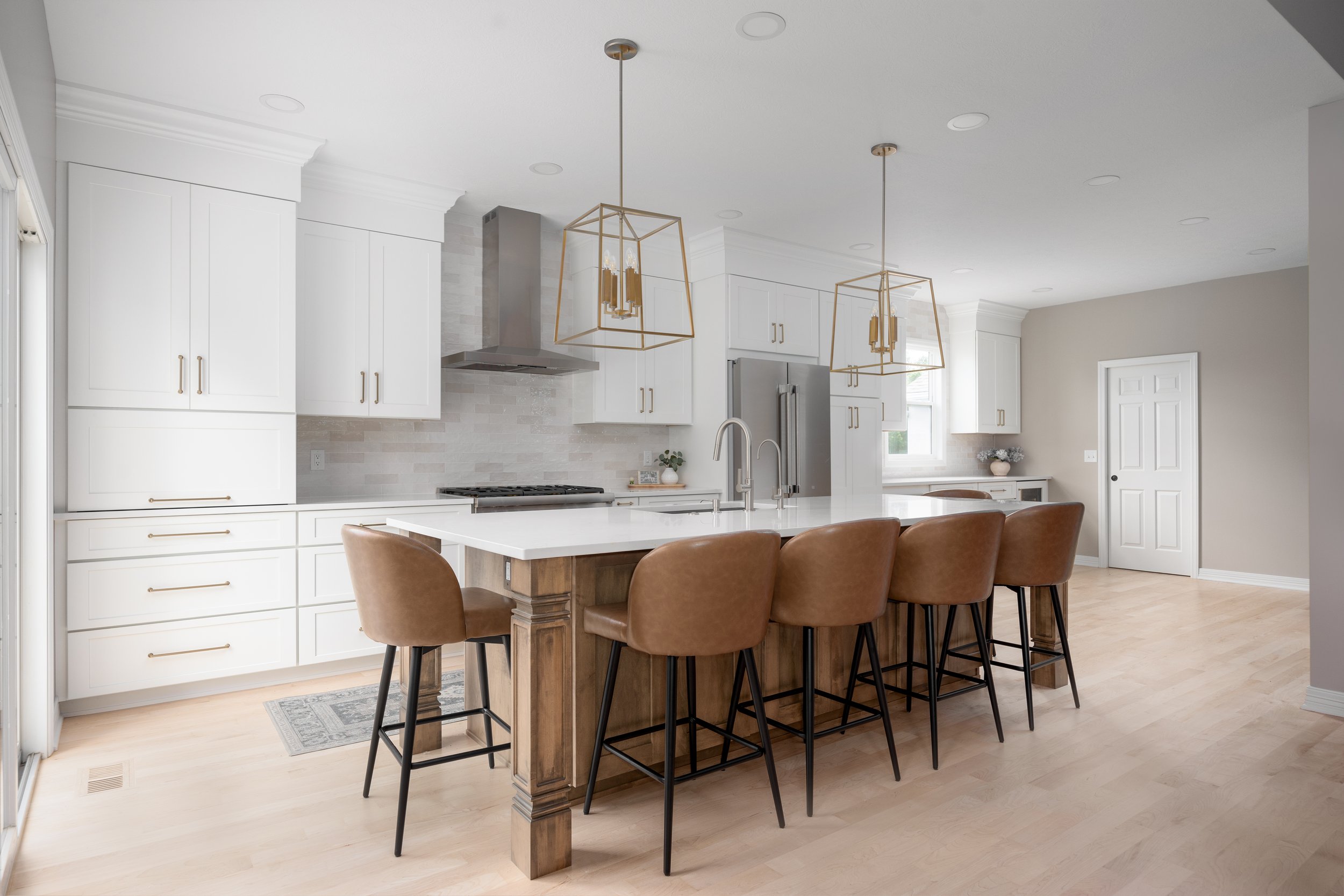 Powell kitchen with a contrasting island and glass-front upper cabinets